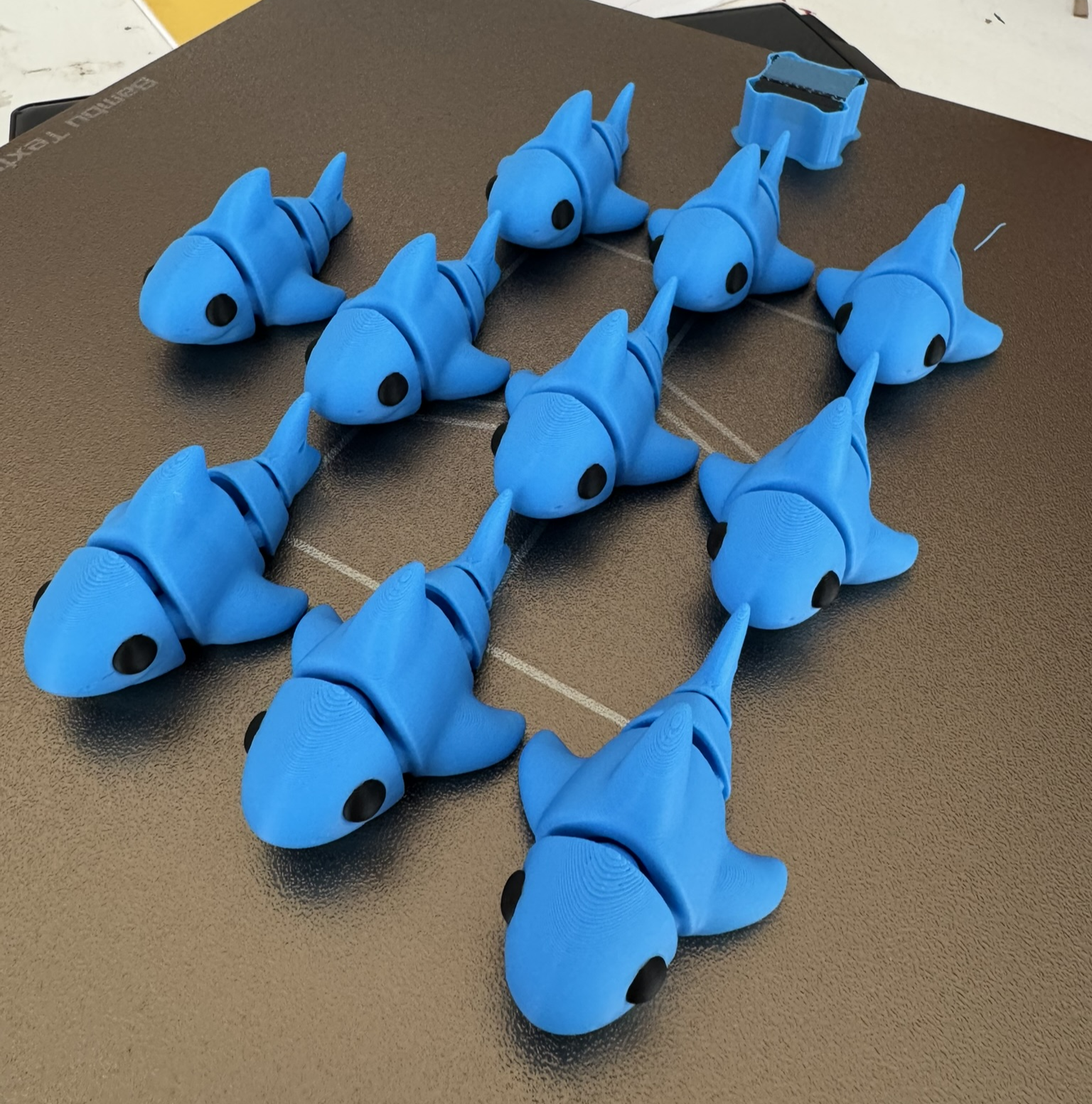 A shoal of articulated 3D printed sharks
